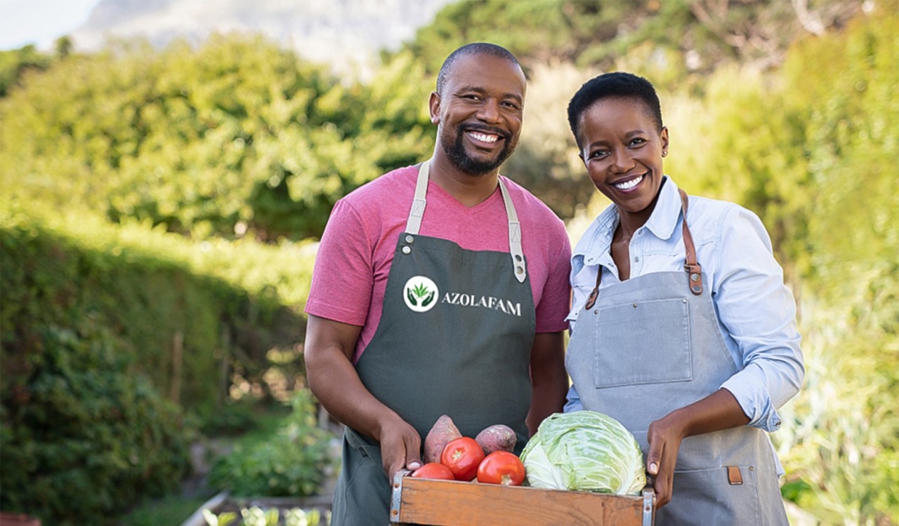 Background of a man and woman holding farm produce